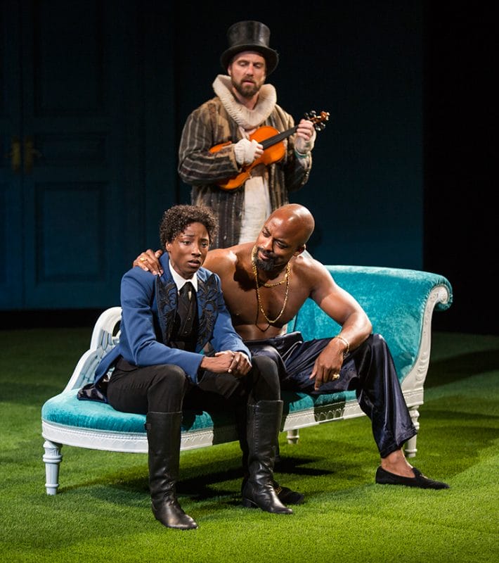 Rutina Wesley as Viola and Terence Archie as Orsino (seated) with Manoel Felciano as Feste in The Old Globe's 2015 Summer Shakespeare Festival production of Twelfth Night, directed by Rebecca Taichman, June 21 - July 26, 2015. Photo by Jim Cox.