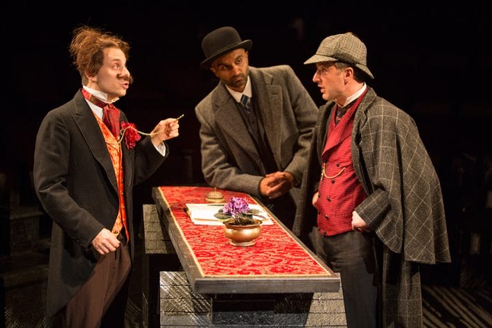 (from left) Blake Segal as Castilian Desk Clerk, Usman Ally as Doctor Watson, and Euan Morton as Sherlock Holmes in Ken Ludwig's Baskerville: A Sherlock Holmes Mystery, directed by Josh Rhodes, July 24 - Aug. 30, 2015 at The Old Globe. Photo by Jim Cox.